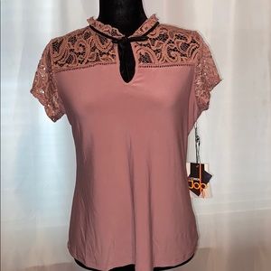Pink blouse with bow in front and lace arms
